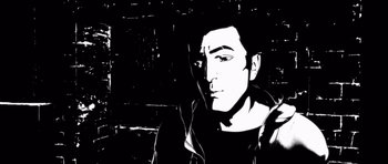 Movie still from “Renaissance” (2006), directed by Christian Volckman – A black and white image of a man in a black shirt; Close Up shot, Low angle