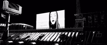 Movie still from “Renaissance” (2006), directed by Christian Volckman – A billboard with a woman's face on top of a building; Extreme Wide shot, Low angle