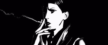 Movie still from “Renaissance” (2006), directed by Christian Volckman – A black and white image of a woman smoking a cigarette; Extreme Close Up shot, Low angle