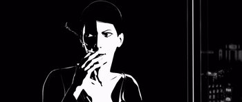 Movie still from “Renaissance” (2006), directed by Christian Volckman – A black and white image of a woman smoking a cigarette; Close Up shot, Low angle