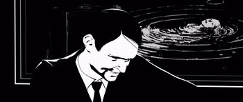 Movie still from “Renaissance” (2006), directed by Christian Volckman – A black and white image of a man in a suit; Close Up shot, High angle