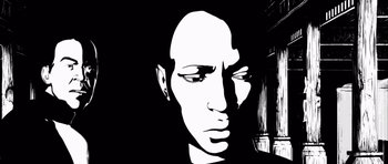 Movie still from “Renaissance” (2006), directed by Christian Volckman – A black and white image of a man's face; Close Up shot, Low angle