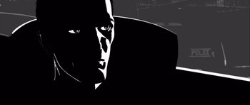 Movie still from “Renaissance” (2006), directed by Christian Volckman – A black and white image of a man's face; Extreme Close Up shot, Low angle