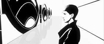 Movie still from “Renaissance” (2006), directed by Christian Volckman – Black and white image of a woman in front of speakers; Extreme Close Up shot, Low angle