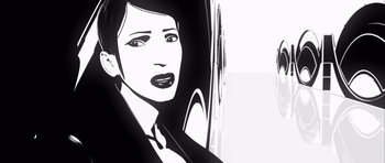 Movie still from “Renaissance” (2006), directed by Christian Volckman – A black and white image of a woman in a suit; Close Up shot, Low angle