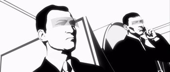 Movie still from “Renaissance” (2006), directed by Christian Volckman – A black - and - white photo of a man in a suit and tie; Close Up shot, Low angle