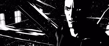 Movie still from “Renaissance” (2006), directed by Christian Volckman – A black and white image of a man in a black jacket; Close Up shot, Low angle