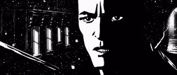 Movie still from “Renaissance” (2006), directed by Christian Volckman – A black and white image of a man's face in front of a space background; Close Up shot, Low angle