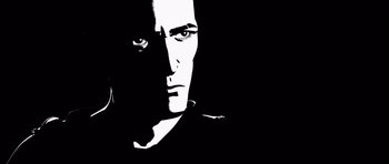 Movie still from “Renaissance” (2006), directed by Christian Volckman – A black and white image of a man's face; Close Up shot, Low angle