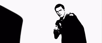 Movie still from “Renaissance” (2006), directed by Christian Volckman – A black and white image of a man holding a gun; Medium shot, Low angle