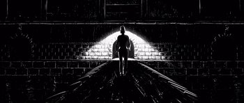 Movie still from “Renaissance” (2006), directed by Christian Volckman – A woman standing on a train track in front of a tunnel; Wide shot, Low angle