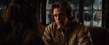 Movie still from “Rent” (2005), directed by Chris Columbus – A person sitting in a room; Close Up shot, Over the shoulder angle