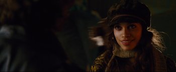 Movie still from “Rent” (2005), directed by Chris Columbus – A person wearing a hat; Close Up shot, Over the shoulder angle