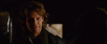 Movie still from “Rent” (2005), directed by Chris Columbus – A person wearing a leather jacket; Close Up shot, Over the shoulder angle