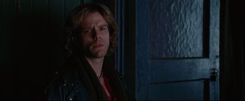 Movie still from “Rent” (2005), directed by Chris Columbus – A person with long hair; Close Up shot, Over the shoulder angle