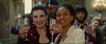 Movie still from “Rent” (2005), directed by Chris Columbus – Two women are holding wine glasses and smiling; Close Up shot, Over the shoulder angle