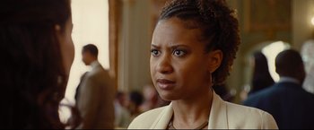 Movie still from “Rent” (2005), directed by Chris Columbus – A person wearing a jacket; Close Up shot, Over the shoulder angle