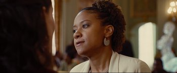 Movie still from “Rent” (2005), directed by Chris Columbus – A person wearing a jacket; Close Up shot, Over the shoulder angle