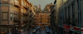Movie still from “Rent” (2005), directed by Chris Columbus – A city street filled with lots of parked cars; Extreme Wide shot, Overhead angle
