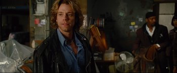 Movie still from “Rent” (2005), directed by Chris Columbus – A person with long hair; Close Up shot, Over the shoulder angle