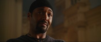 Movie still from “Rent” (2005), directed by Chris Columbus – A person wearing a hat; Close Up shot, Low angle