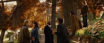 Movie still from “Rent” (2005), directed by Chris Columbus – A group of people standing next to a tree; Wide shot, High angle