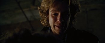 Movie still from “Rent” (2005), directed by Chris Columbus – A person with curly blonde hair; Close Up shot, Over the shoulder angle