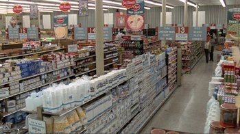 Movie still from “Repo Man” (1984), directed by Alex Cox – A grocery store filled with lots and lots of food; Extreme Wide shot, High angle