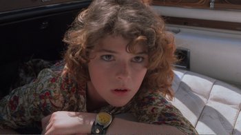 Movie still from “Repo Man” (1984), directed by Alex Cox – A person wearing a watch; Close Up shot, Low angle