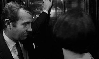 Movie still from “Repulsion” (1965), directed by Roman Polanski – A black and white photo of a man and a woman; Close Up shot, Over the shoulder angle