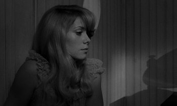 Movie still from “Repulsion” (1965), directed by Roman Polanski – A black and white photo of a woman with long hair; Close Up shot, Over the shoulder angle