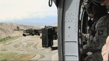 Movie still from “Restrepo” (2010), directed by Tim Hetherington – View of a military helicopter's cockpit; Wide shot, High angle