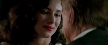 Movie still from “Revenge” (1990), directed by Tony Scott – A woman's face and a man's face; Close Up shot, Over the shoulder angle