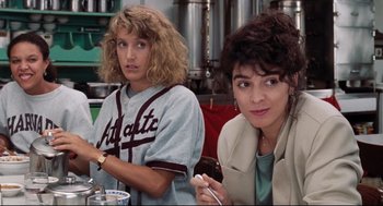 Movie still from “Reversal of Fortune” (1990), directed by Barbet Schroeder – Two women sitting next to each other in a room; Medium shot, Over the shoulder angle