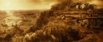 Movie still from “Riddick” (2013), directed by David Twohy – An aerial view of a desert with smoke coming out of it; Extreme Wide shot, Overhead angle