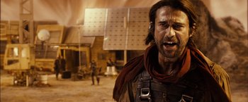 Movie still from “Riddick” (2013), directed by David Twohy – A person with a beard; Close Up shot, Low angle