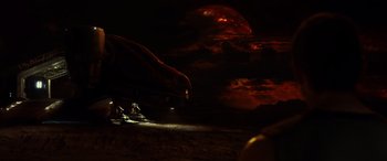 Movie still from “Riddick” (2013), directed by David Twohy – A dark sky with a red moon and a train; Extreme Wide shot, Low angle