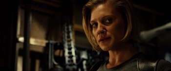 Movie still from “Riddick” (2013), directed by David Twohy – A person with short blonde hair; Close Up shot, Low angle