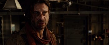 Movie still from “Riddick” (2013), directed by David Twohy – A person wearing a scarf; Close Up shot, Over the shoulder angle