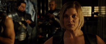 Movie still from “Riddick” (2013), directed by David Twohy – A person with a gun; Close Up shot, Over the shoulder angle