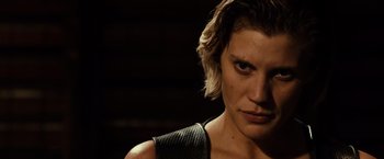 Movie still from “Riddick” (2013), directed by David Twohy – A person with short blonde hair; Close Up shot, Low angle