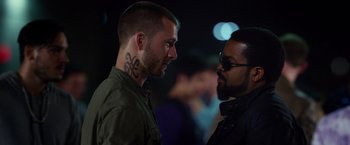 Movie still from “Ride Along 2” (2016), directed by Tim Story – Two men are facing each other in the dark; Close Up shot, Over the shoulder angle