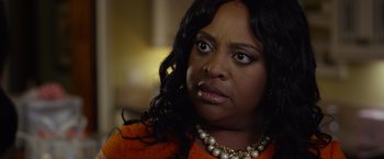 Movie still from “Ride Along 2” (2016), directed by Tim Story – A person wearing a necklace; Close Up shot, Over the shoulder angle