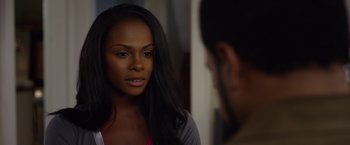Movie still from “Ride Along 2” (2016), directed by Tim Story – A beautiful young woman standing in front of a mirror; Close Up shot, Over the shoulder angle