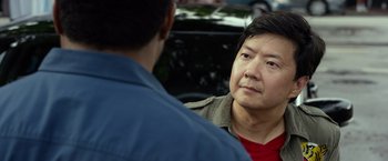 Movie still from “Ride Along 2” (2016), directed by Tim Story – A man in a red shirt is talking to another man; Close Up shot, Over the shoulder angle