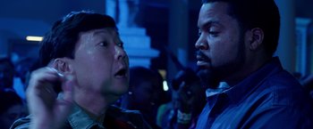 Movie still from “Ride Along 2” (2016), directed by Tim Story – Two people are looking at each other in a dark room; Close Up shot, Over the shoulder angle