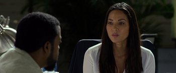 Movie still from “Ride Along 2” (2016), directed by Tim Story – A woman sitting next to a man in a car; Close Up shot, Over the shoulder angle