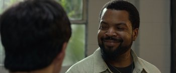 Movie still from “Ride Along 2” (2016), directed by Tim Story – A man with a goatee talking to another man; Close Up shot, Over the shoulder angle