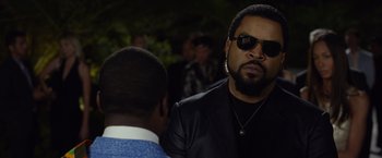 Movie still from “Ride Along 2” (2016), directed by Tim Story – A man in a black jacket and a man in a black jacket; Close Up shot, Over the shoulder angle