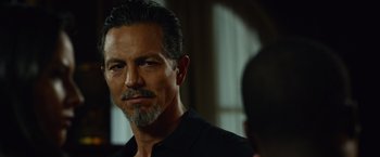 Movie still from “Ride Along 2” (2016), directed by Tim Story – A person wearing a black shirt; Close Up shot, Over the shoulder angle